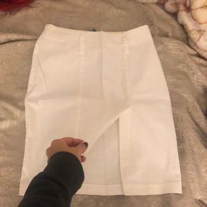 White skirt , open slit in middle